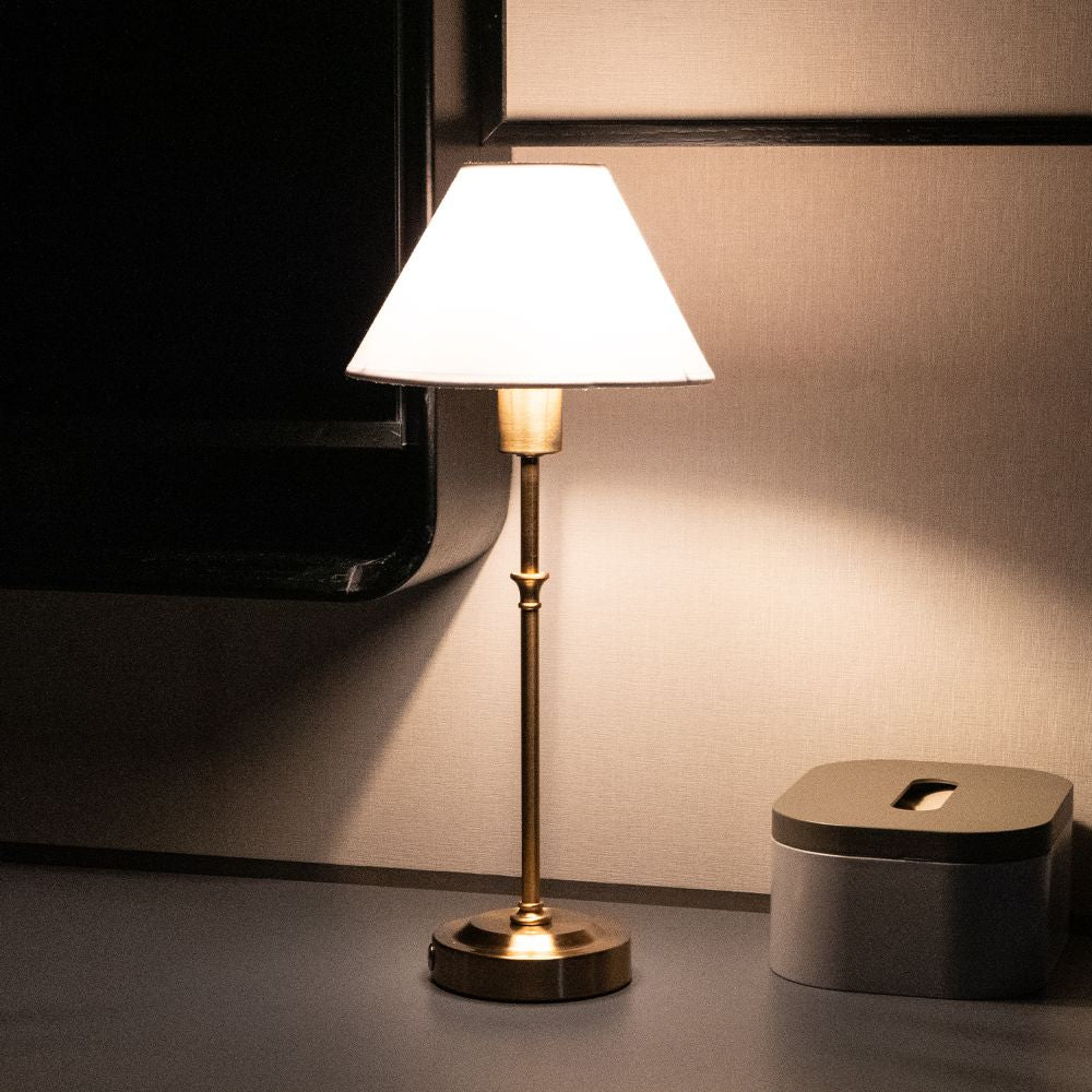 white fabric bedside lamp